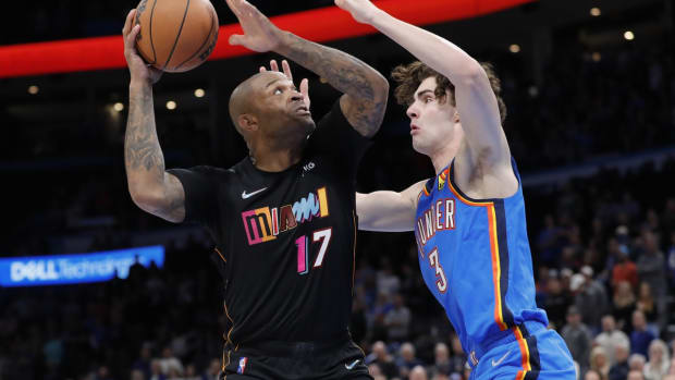 Nov 15, 2021; Oklahoma City, Oklahoma, USA; Miami Heat forward P.J. Tucker (17) goes to the basket as Oklahoma City Thunder guard Josh Giddey (3) defends during the first quarter at Paycom Center. Mandatory Credit: Alonzo Adams-USA TODAY Sports